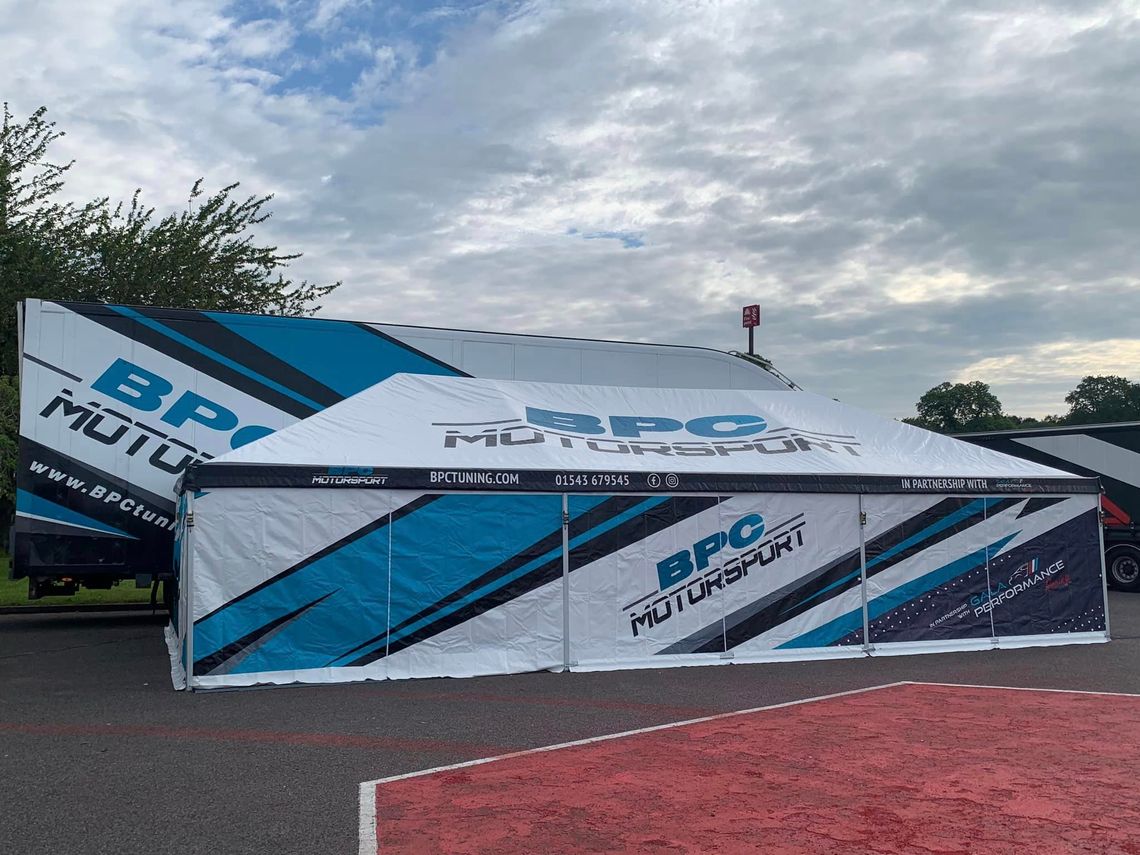 A motorsport awning with BPC tuning printed onto it