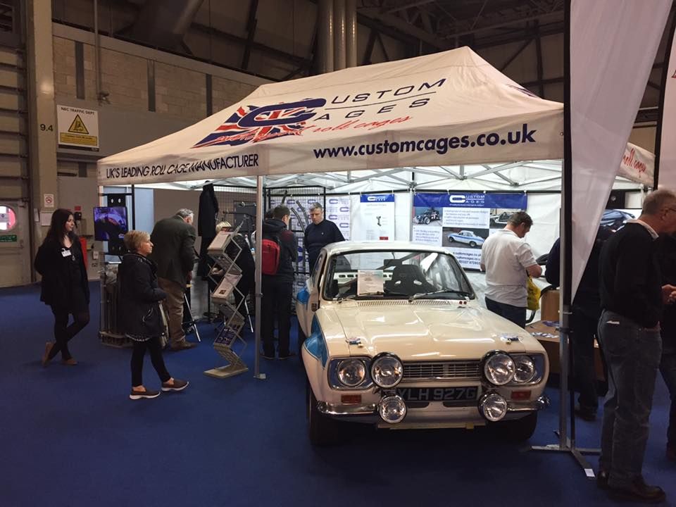 WHite printed gazebo at a motorsport trade show